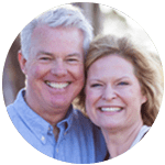Mature couple side by side smiling