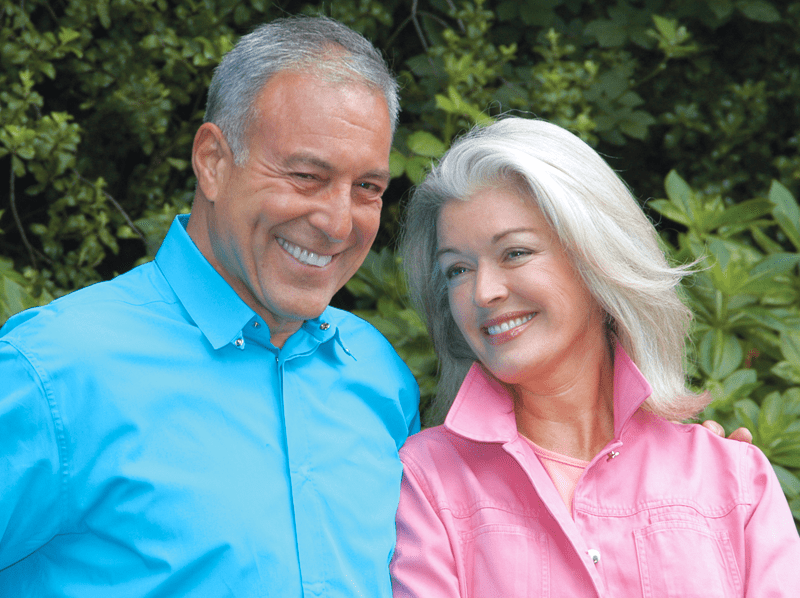 Mature couple standing together smiling
