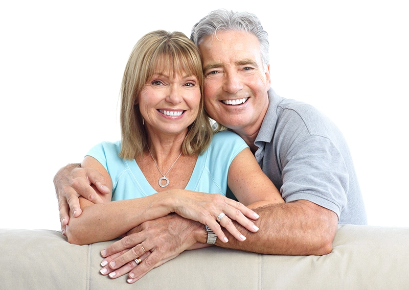 Senior Happy Couple With Dental Implants From Matthews Dental Care